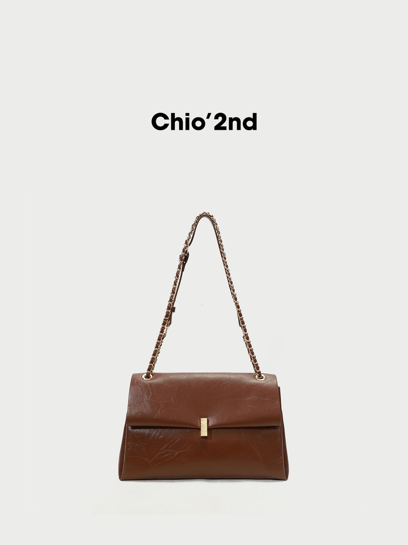 Brown leather shoulder handbag with chain strap on a white background