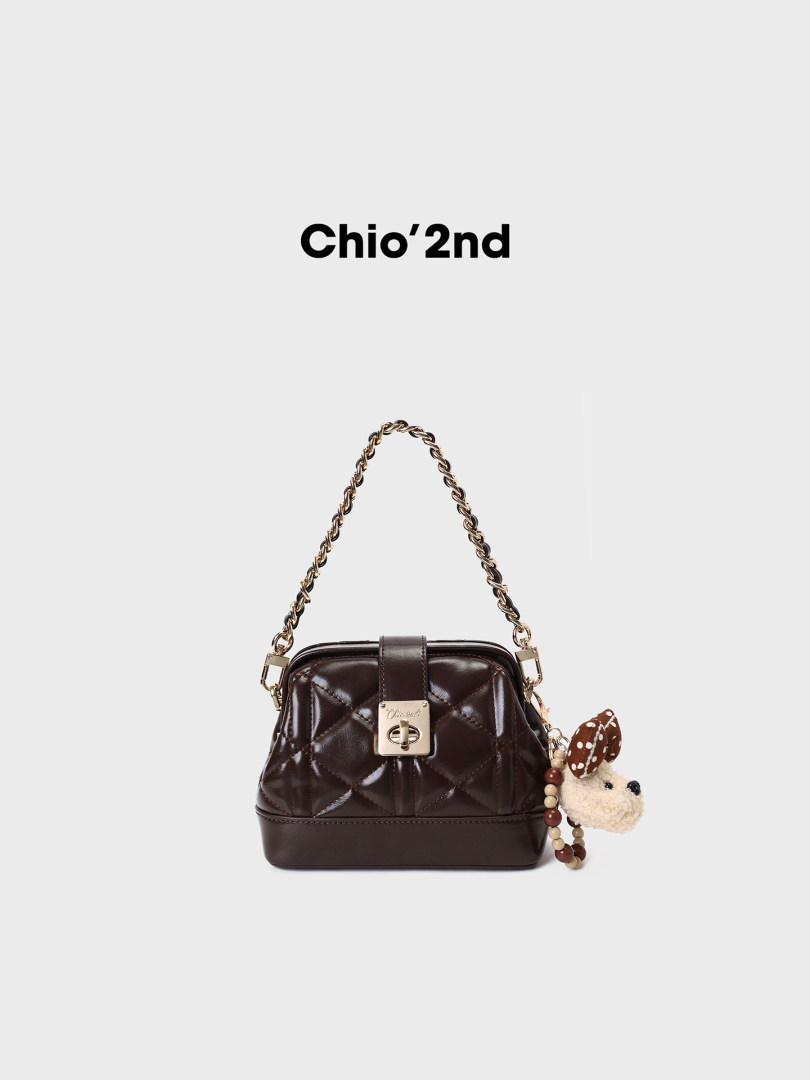 Brown quilted chain-strap handbag with charm accessory
