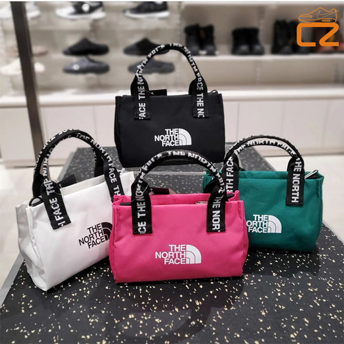 北面手提斜挎黑色白色帆布包