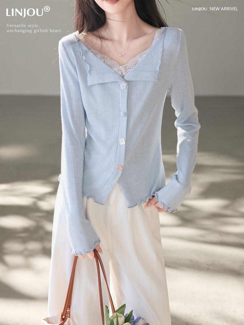 Light blue button-front cardigan worn over a lace-trim camisole on a model