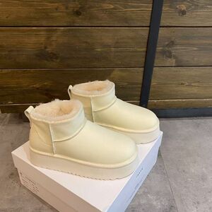 白色真皮防水厚底增高雪地靴女短筒百搭东北大棉鞋棉靴子2024新款