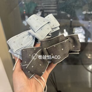 642703韩国东大门Baket新款高级感甜美蝴蝶结布艺满天星香蕉夹