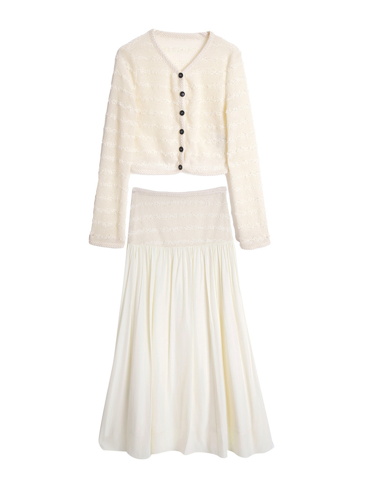 Cream knit cardigan and matching long skirt set laid flat on white background