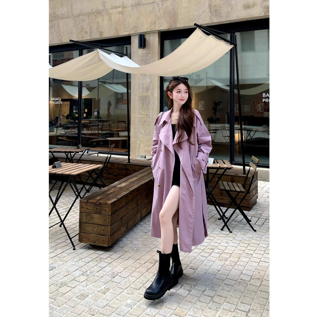 Lavender long trench coat worn by a model outdoors