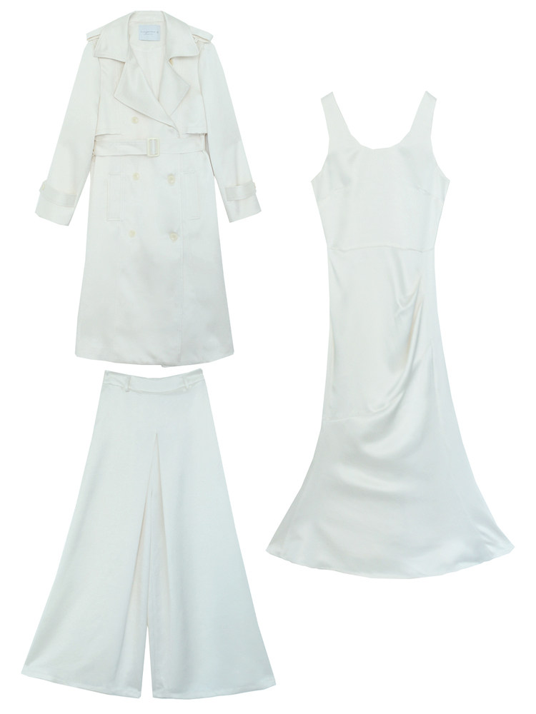 White clothing set with a trench coat, sleeveless dress, and wide-leg pants laid flat