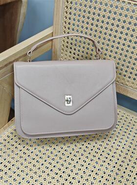 外贸出口头层牛皮专柜品牌特价处理清货真皮手提斜挎库存日韩女包