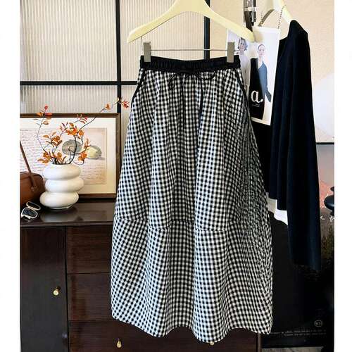 今年流行的漂亮盐系穿搭轻熟复古格子花苞半身裙棉麻休闲茧型裙子