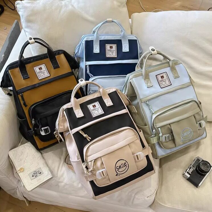 书包女大学生轻便2026新款手提背包多功能日系学院风大容量双肩包