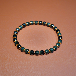 秋会长的和田玉新疆天然黑青猫眼NGTC大证籽料手串手链22K金盾5x6