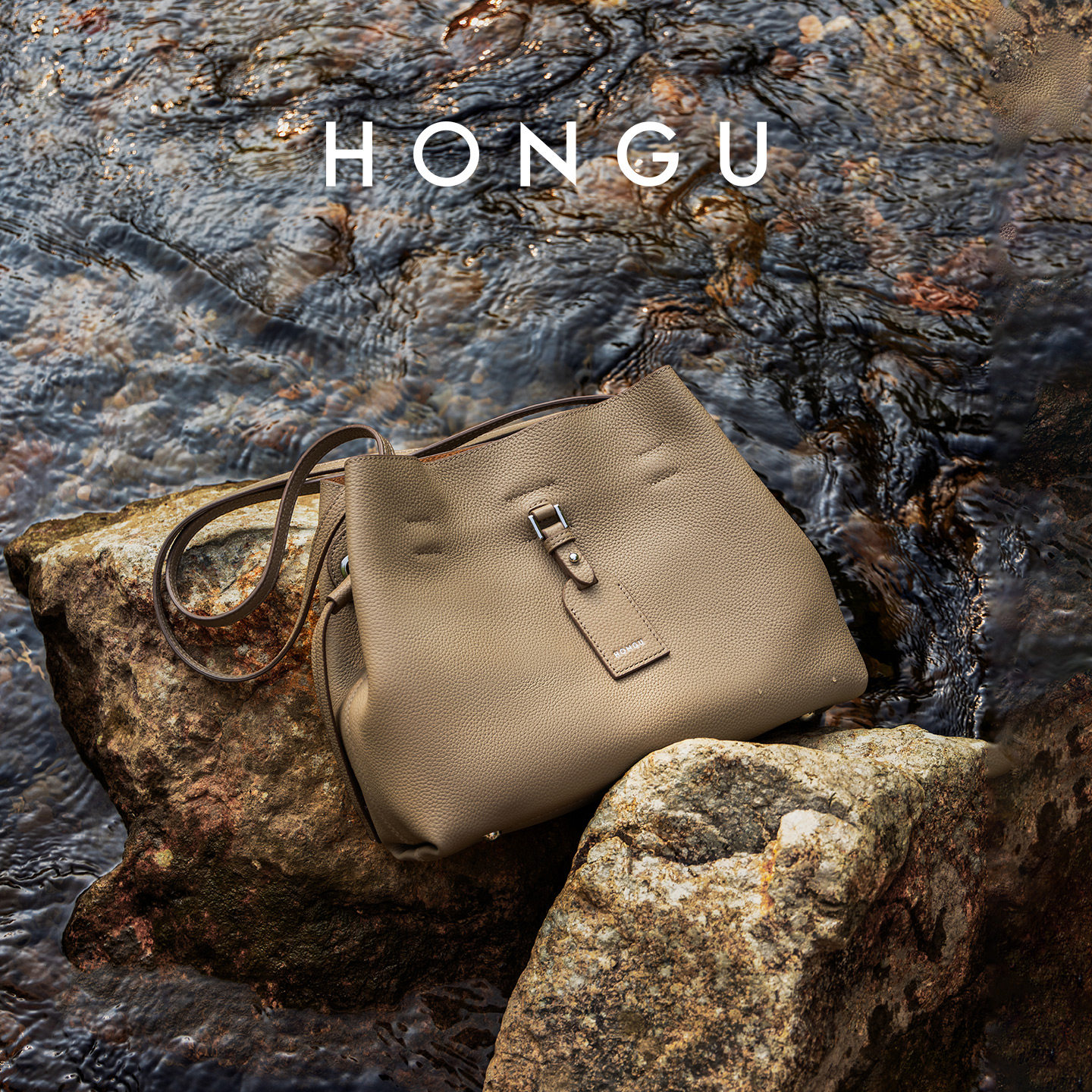 红谷包包女式2025新款真皮单肩斜挎包通勤上班大容量水桶包女士包