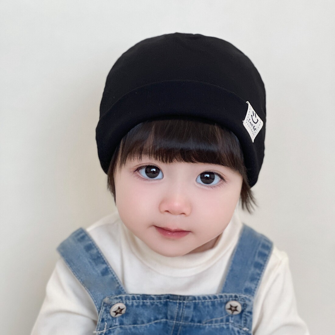 春秋双层保暖婴儿帽0-12月婴幼儿套头胎帽黑色笑脸布标简约包头帽