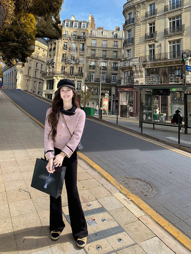 Woman wearing a pink and black chic outfit on a city street