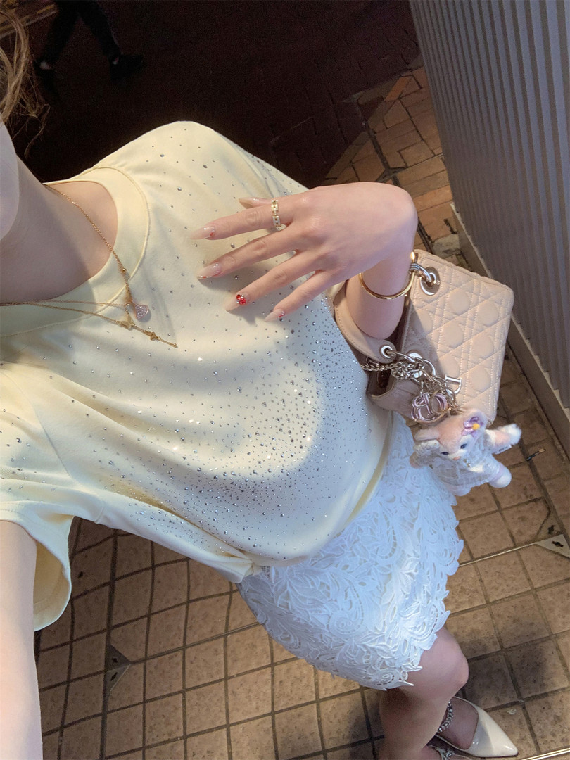 Cream embellished top with white lace skirt worn as a dressy outfit