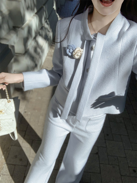 Light blue tailored suit worn by a model with matching trousers