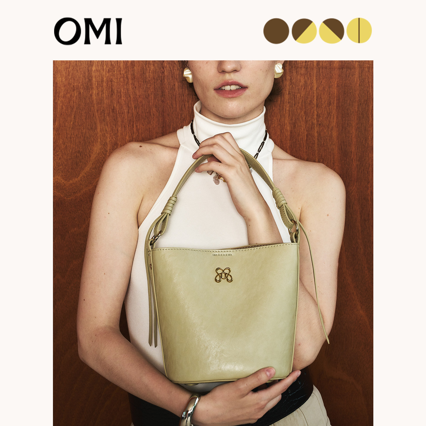 欧米OMI通勤小水桶包手提斜挎时尚轻奢小众设计款包包女2026新款