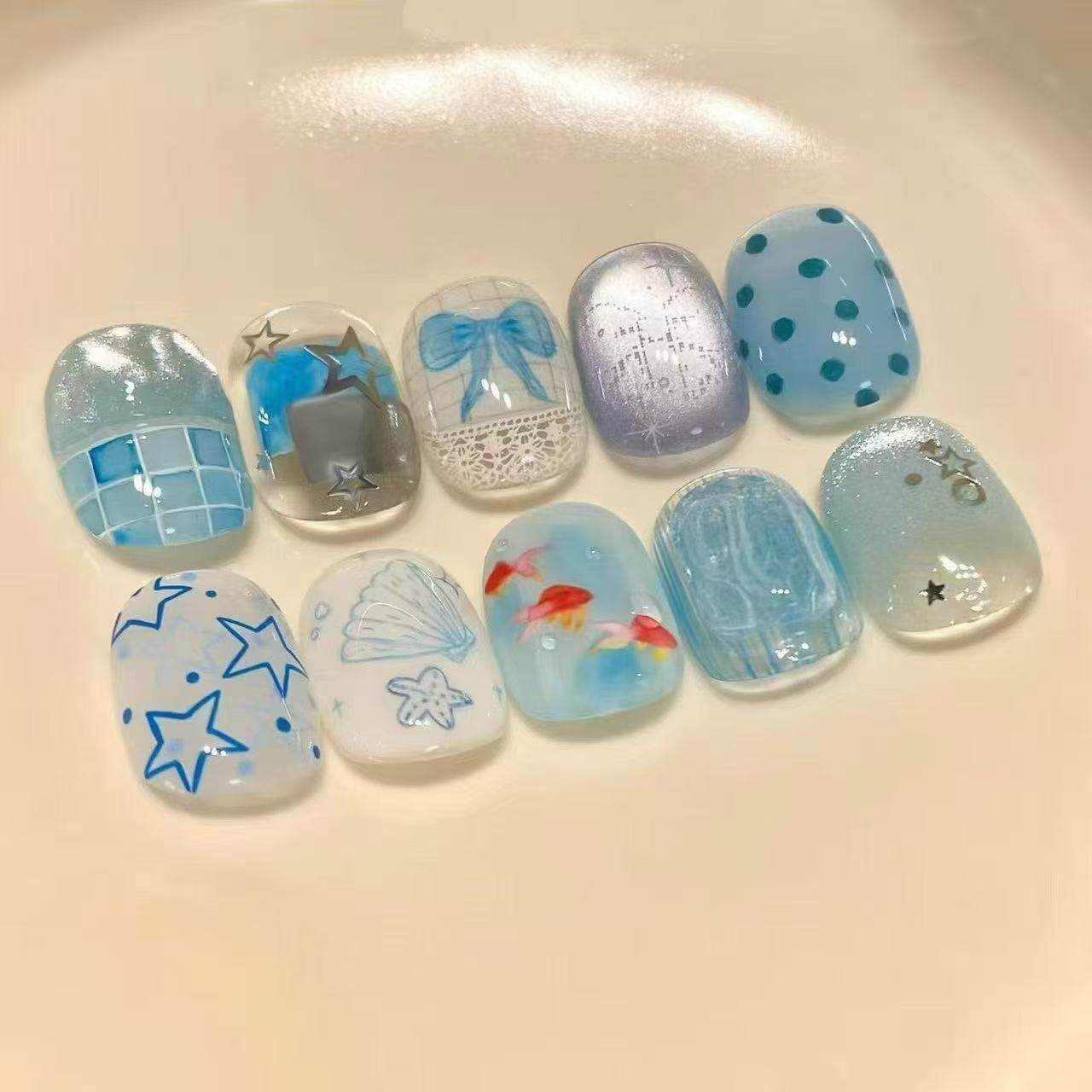浅蓝海波穿戴甲金鱼贝壳星星