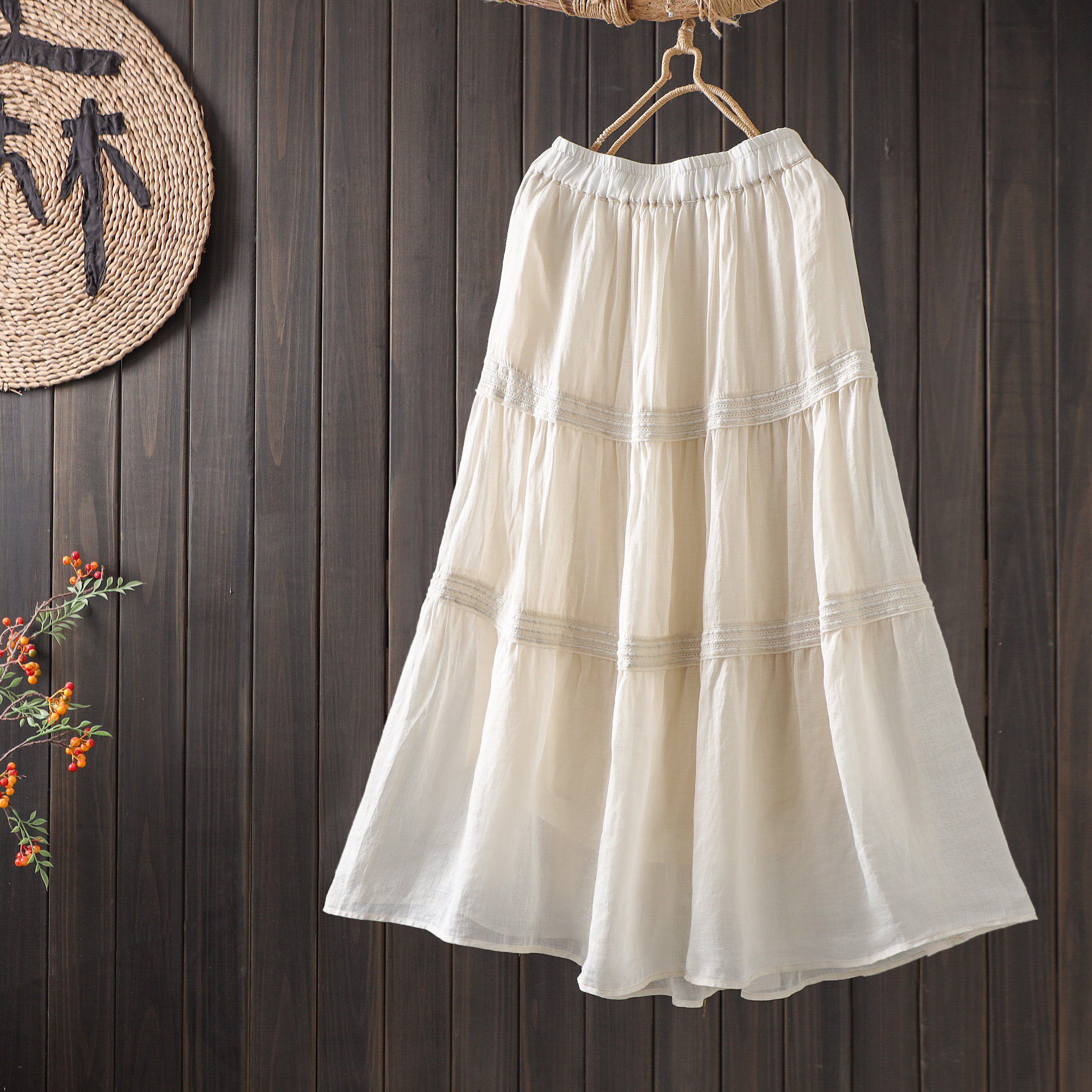 高品质简约2026新款松紧高腰显瘦蕾丝拼接半身裙女气质A字中长裙