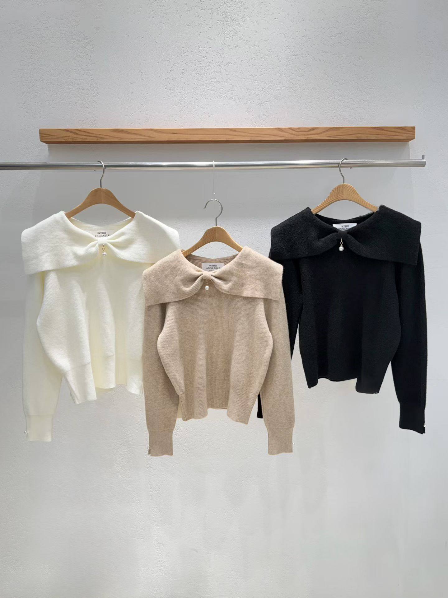 韩国东大门2026春季新款INTRO甜美减龄蝴蝶结翻领长袖毛衣