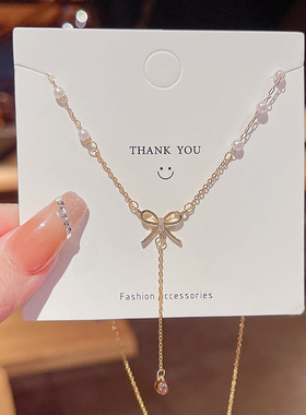 女蝴蝶结流苏钛钢项链