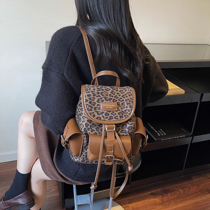 韩版个性豹纹双肩包女高颜值抽绳水桶小背包女生多口袋复古小书包