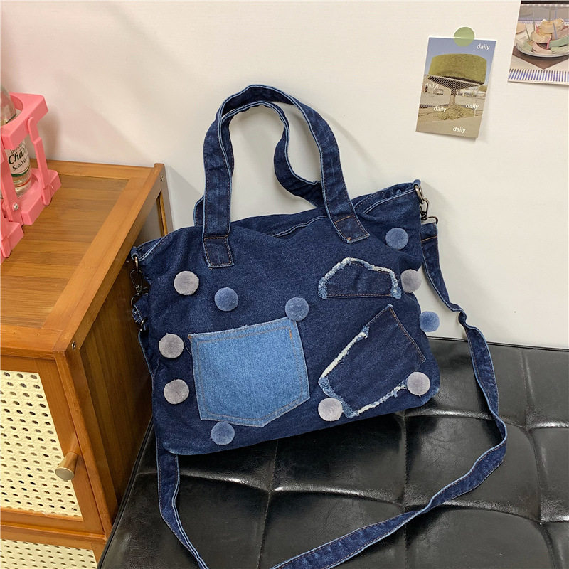 潮流个性水洗牛仔布包包2026新款大容量拼接撞色毛球单肩斜挎包女
