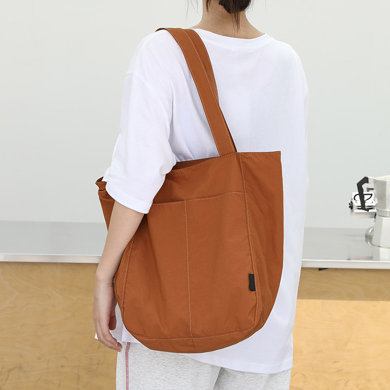慵懒风大容量尼龙布托特包女休闲百搭手提水桶包韩系学生上课单肩,箱包皮具/热销女包/男包,水桶包,淘宝优惠券,粉丝福利购,淘宝优惠卷