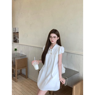 白色连衣裙女2026新款夏法式双排扣泡泡袖花边衬衫短裙少女公主风