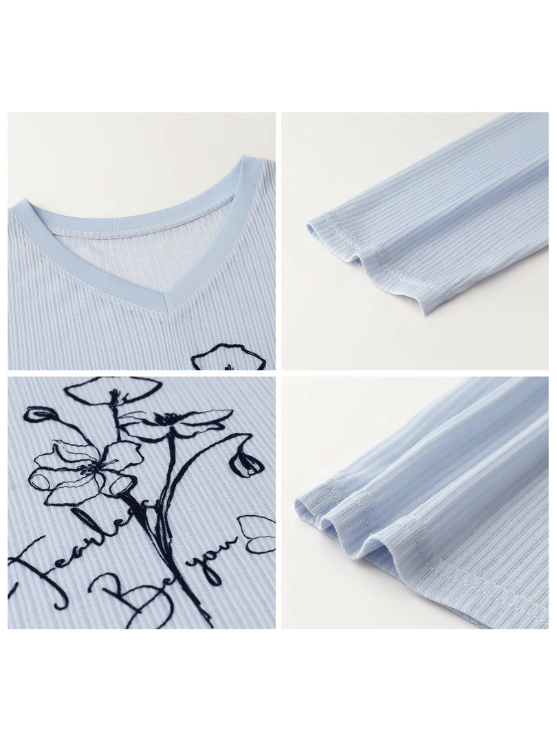 Light blue ribbed long-sleeve top with floral print details