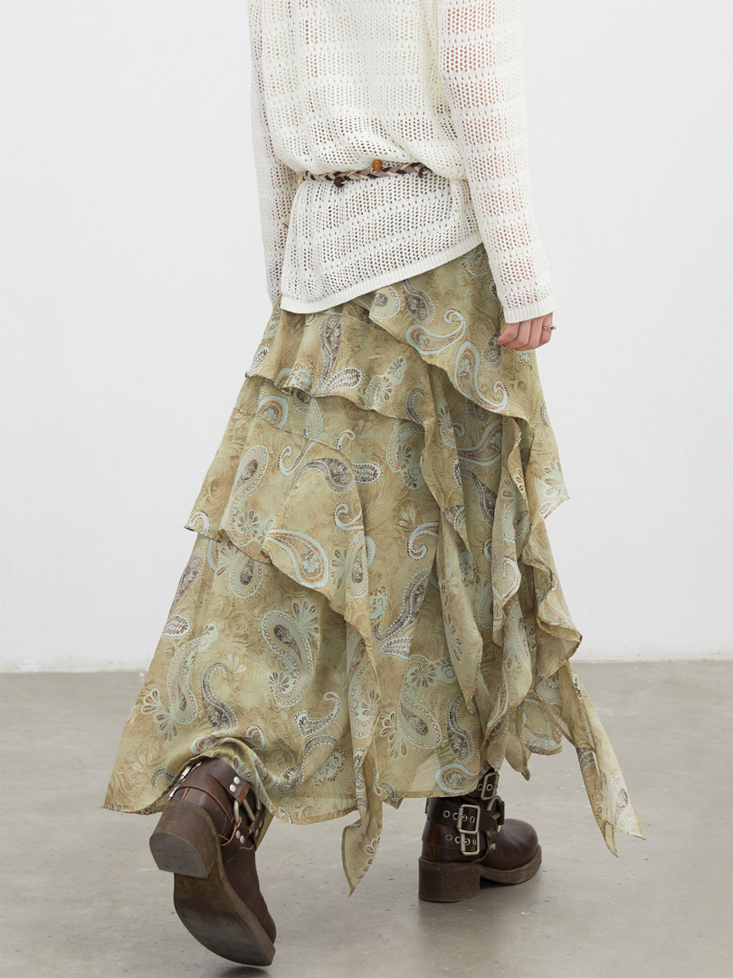 Paisley ruffled maxi skirt worn with boots and a white knit top