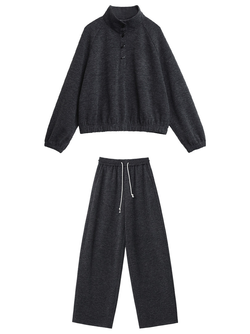 Dark gray loungewear set with a long-sleeve top and wide-leg pants on a white background