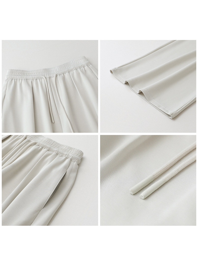 Light beige pants shown in close-up flat lay views