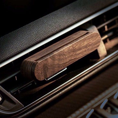 Wooden car-mounted mosquito repellent and air freshener.