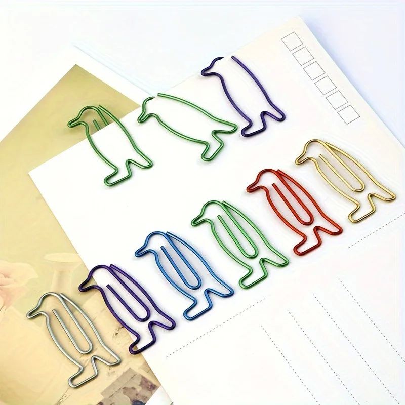 20 or 50 penguin-shaped paper clips and small penguin-shaped