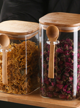 Glass sealed container with a spoon - kitchen storage contai