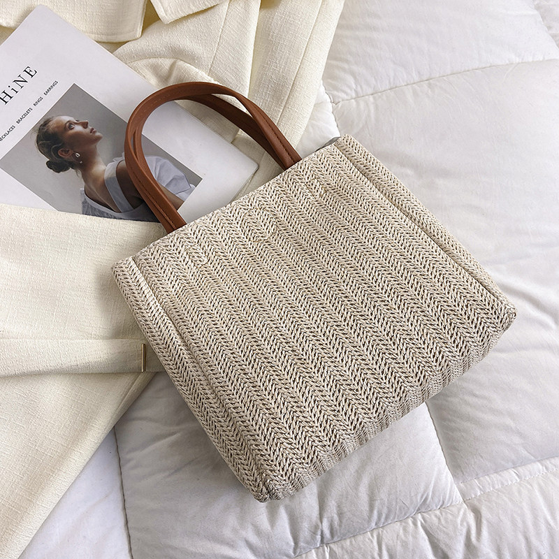 草编包包女2026新款ins藤编大容量水桶包沙滩编织撞色手提托特包