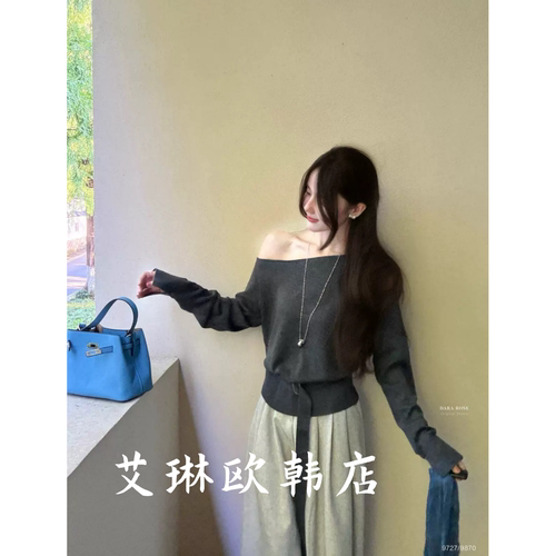9727斜领下摆腰带收腰针织衫