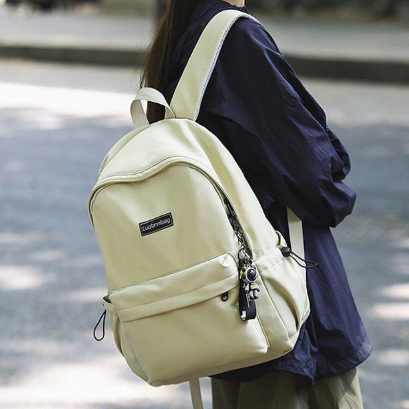 2026纯色轻文艺高颜值韩版青少年男女大小号双肩背大中小学生书包