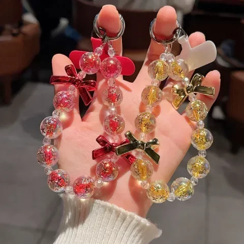 手提串珠精美防丢挂饰高端手机链链条挂件挂绳个性微透短款蝴蝶结