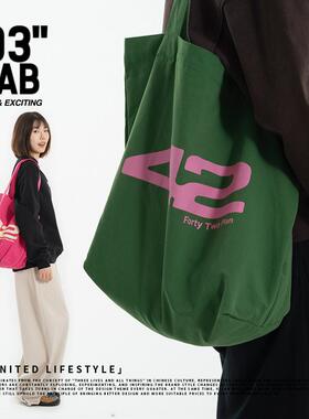 青岛03零叁字母斜挎大容量女大学生慵懒风上班通勤托特包帆布包袋
