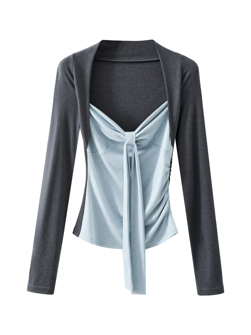 Long-sleeve colorblock wrap top with a tie-front detail on a white background