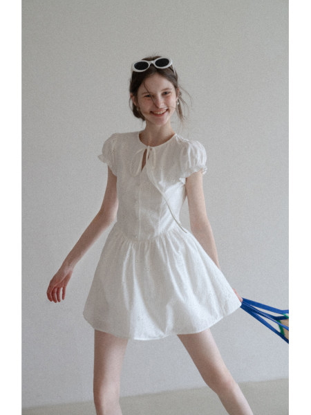 White short-sleeve dress worn by a model