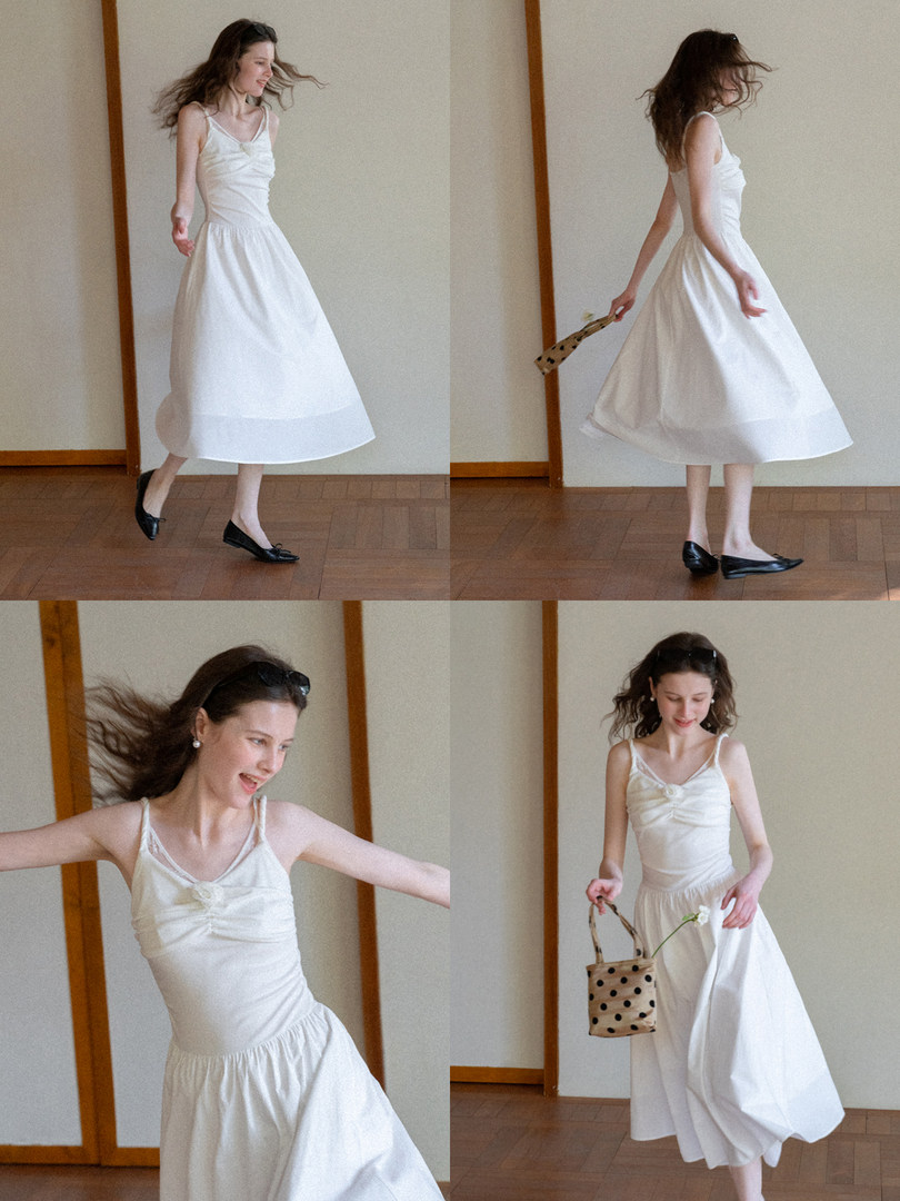 White sleeveless midi dress worn by a model