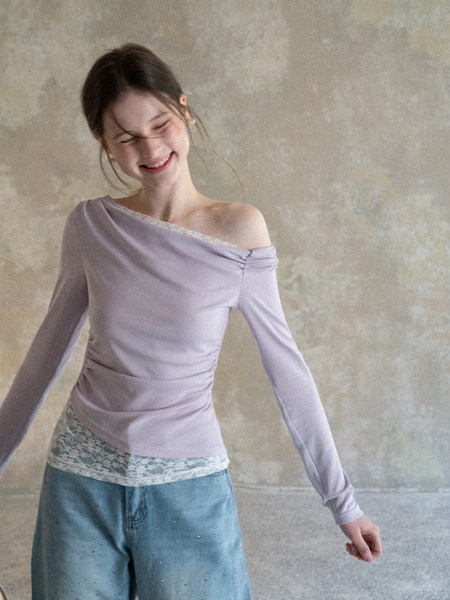 Woman wearing a lavender off-shoulder long-sleeve top