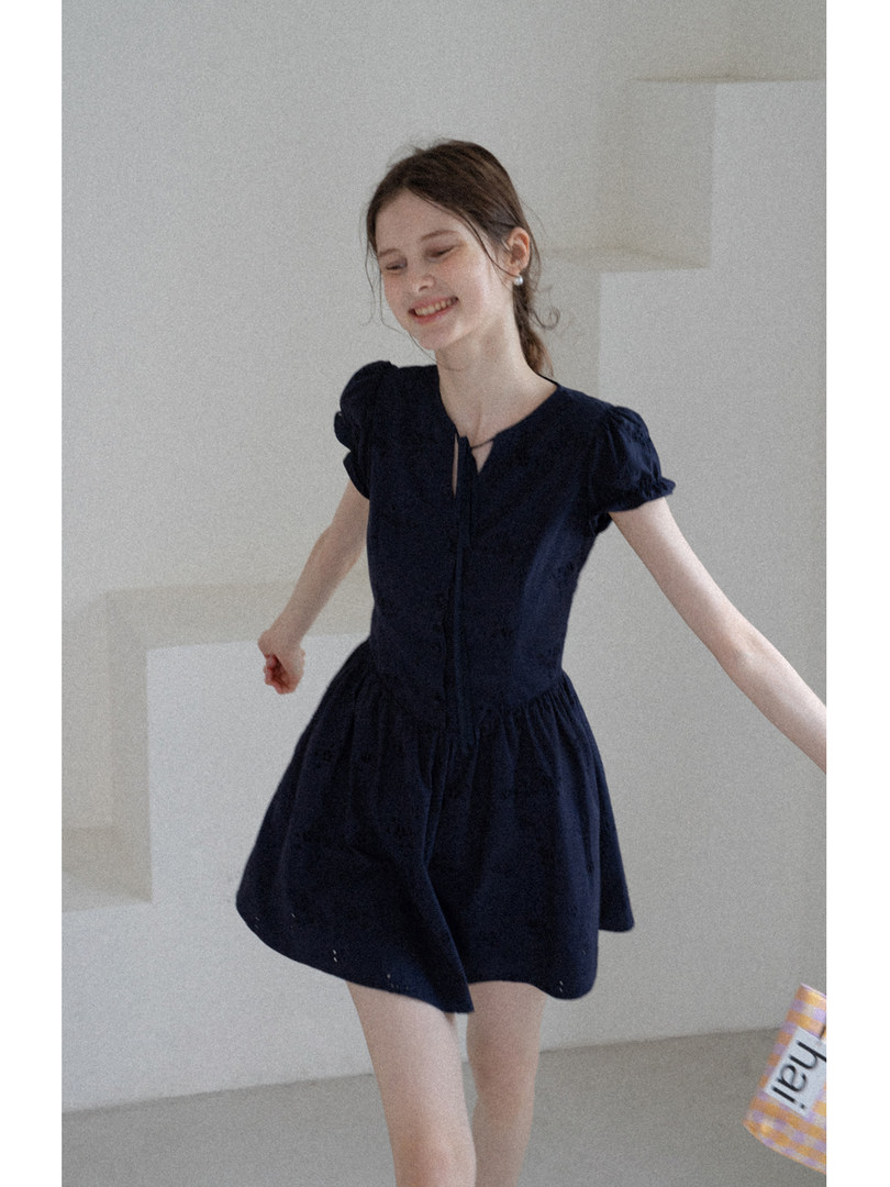 Woman modeling a navy short-sleeve dress