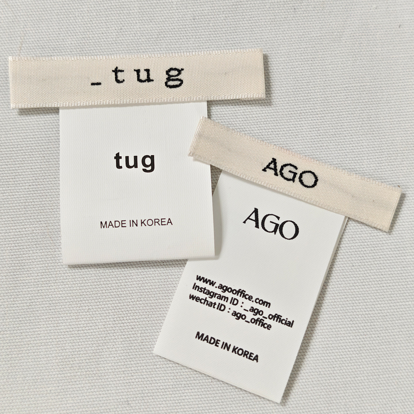 AGO/ tug韩国服装领标洗水标现货 商标布标签缎面织边织唛 侧标签
