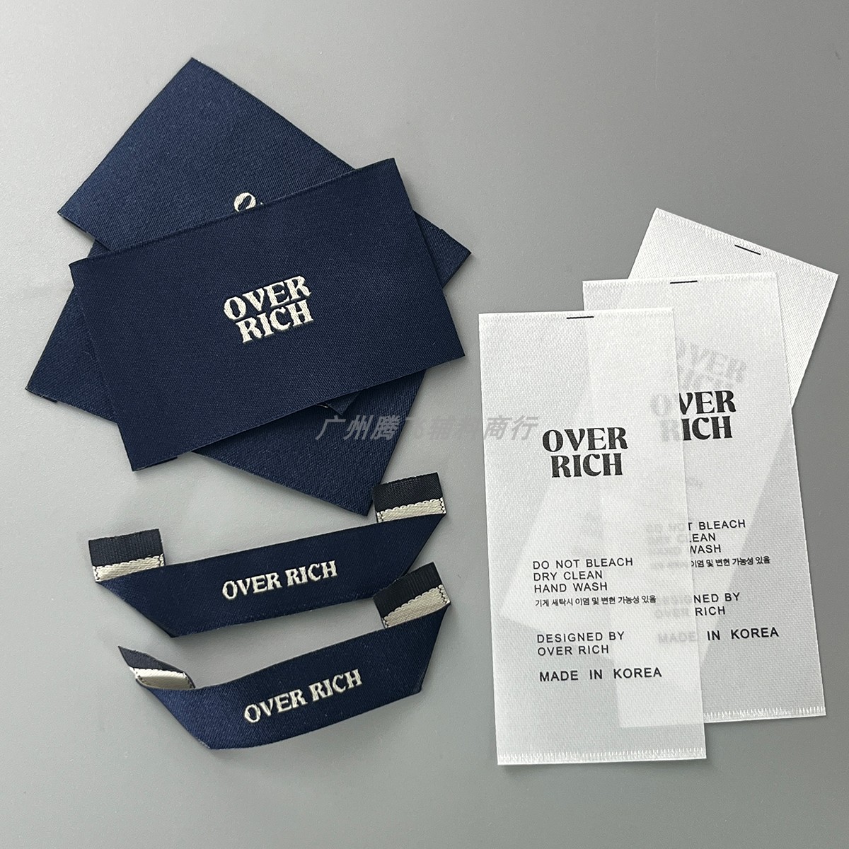 韩国服装领标洗水标现货 衣服商标布标签 双锦织唛高密度主唛定制