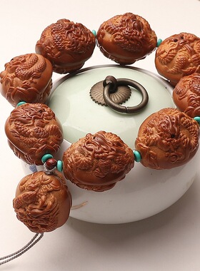 巴西橄榄核大籽手把件浮雕九龙献瑞手持八大财神文玩手串双面雕刻