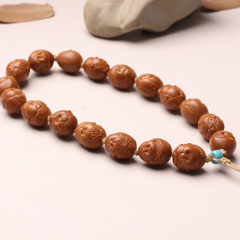 手工橄榄核雕刻小籽可爱铁核豆丁大头弥勒佛橄榄胡手串十小佛手持