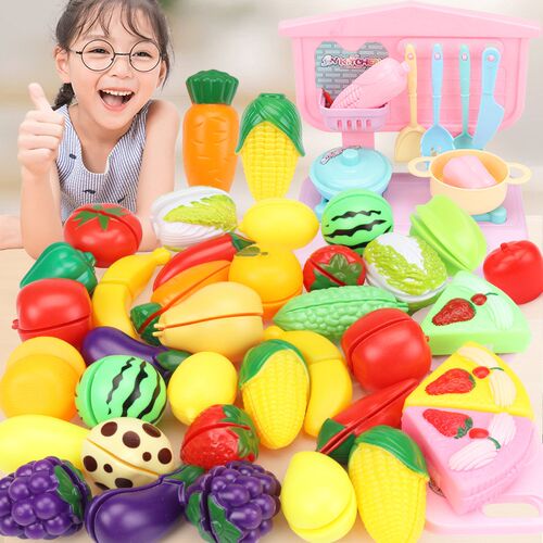Children imitate cutting fruit for kitchen toys