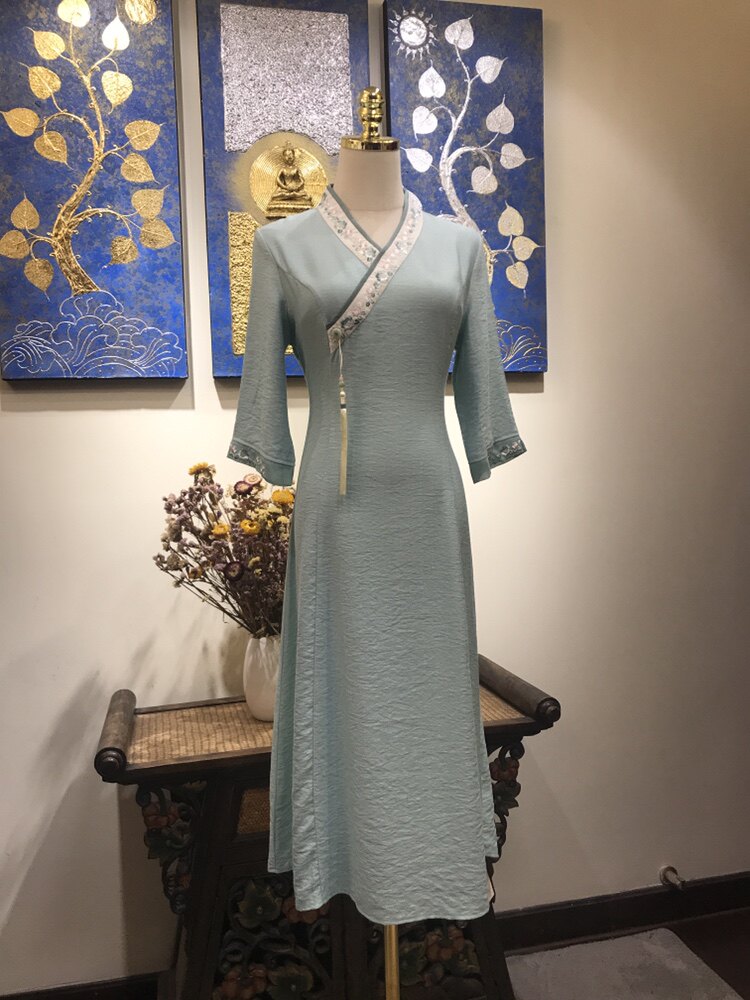 木棉道国风天丝棉汉服领绣花收腰配流苏七分袖中长连衣裙